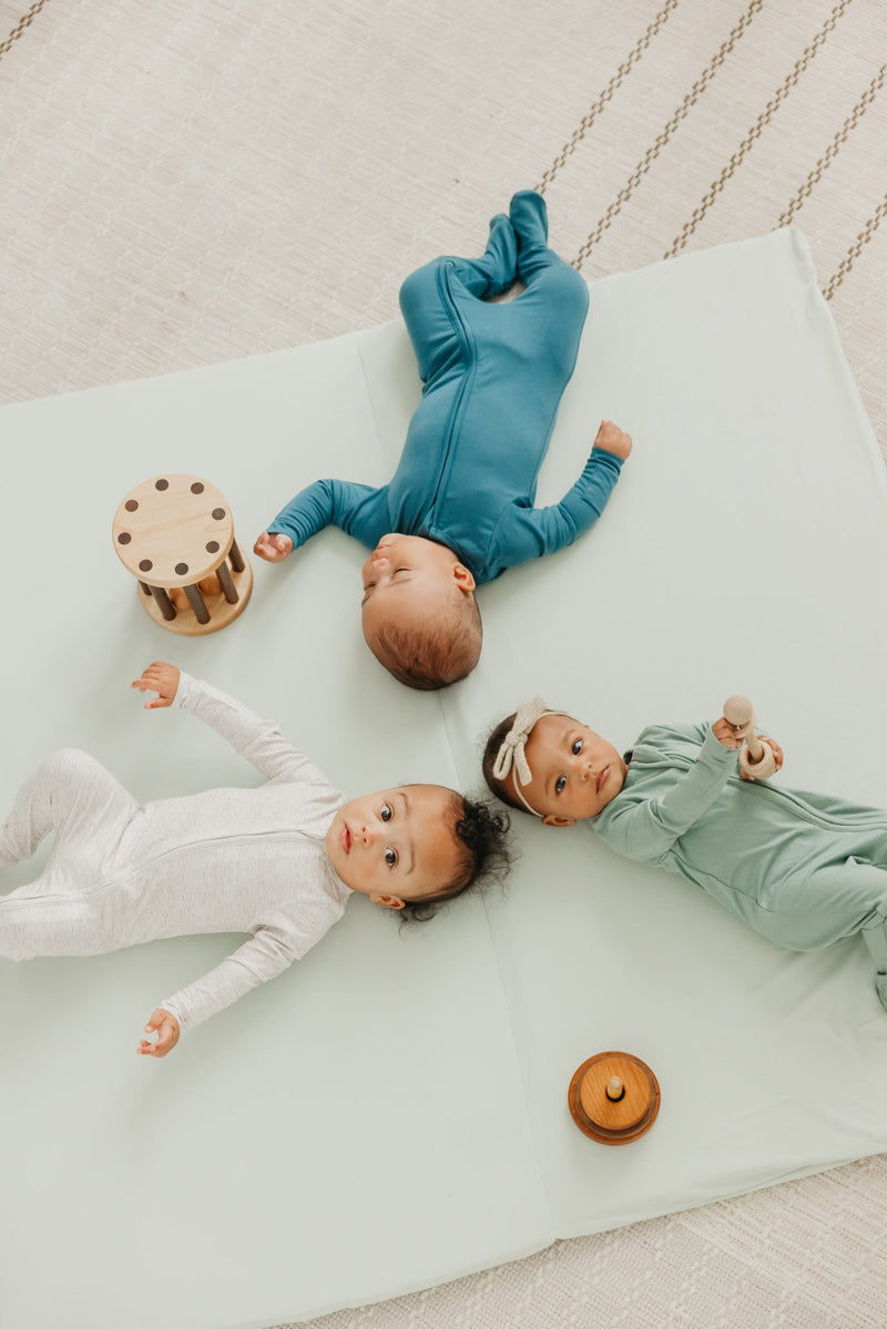 Babies on the Copper Pearl play mat